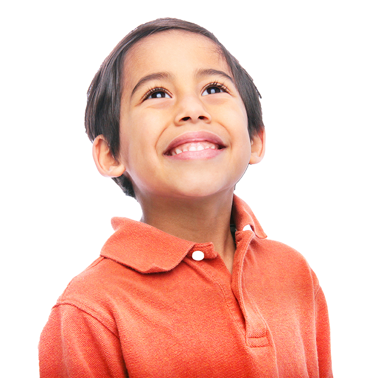 A young boy smiling for the camera.