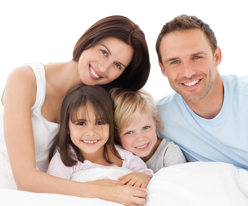 A family posing for the camera in their bedroom.